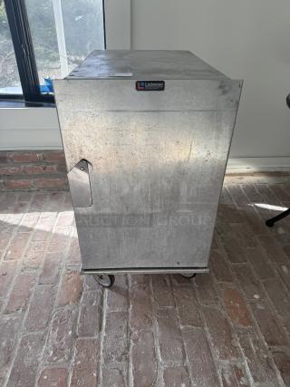 Lockwood commercial mobile half-size pan rack, stainless steel, on wheels, Lockwood logo visible, suitable for bakeries.