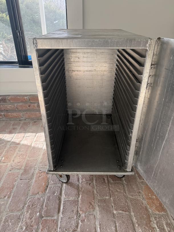 Sturdy Lockwood half-size mobile pan rack, commercial grade, metal construction, caster wheels, ideal for bakery use.