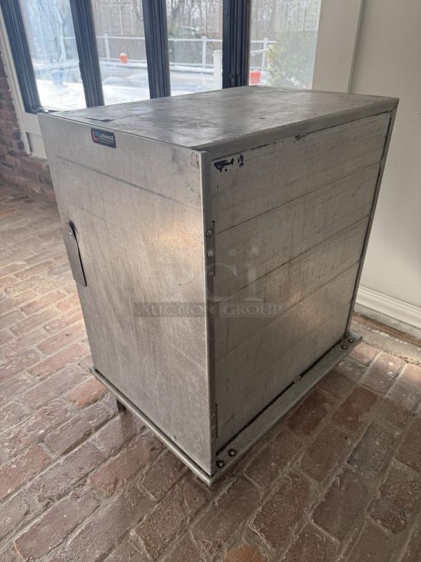 Lockwood mobile half-size pan rack/proofing cabinet; commercial grade, sturdy, metal; features Lockwood branding; used condition.