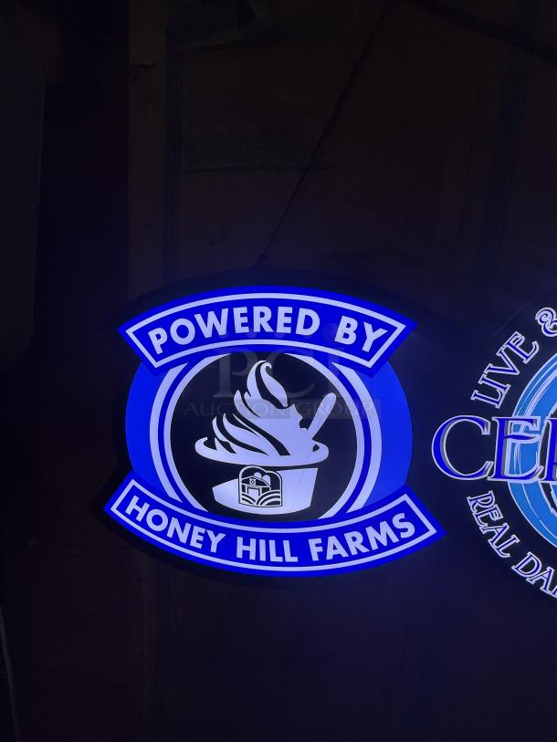 LED light-up sign for frozen yogurt shop, featuring "Powered by Honey Hill Farms" in bright blue and white.