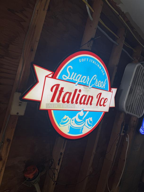 LED light-up sign for Sugar Creek Soft Italian Ice, featuring vibrant red, blue, and white colors. Ideal for decor.