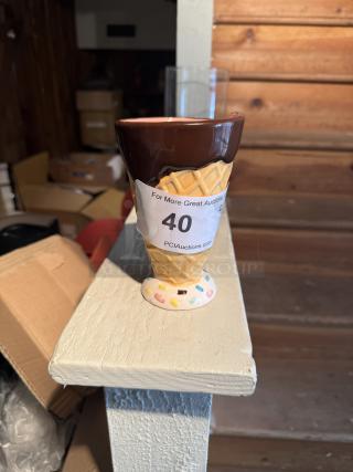 Ceramic ice cream cone mug used as pen holder, waffle cone design, sprinkles base, auction tag with number 40, sturdy condition.