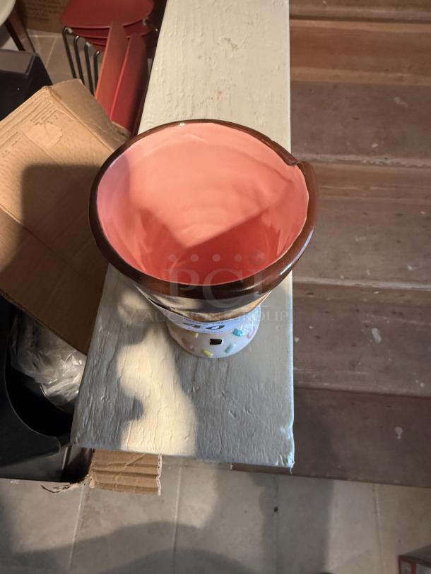 Ceramic ice cream cone mug, pink interior, perfect for holding pens and pencils. Fun, sturdy design for home or office.