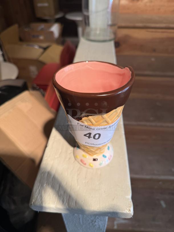 Ceramic ice cream cone mug, chocolate-topped design, pink interior, slight chip on rim, auction label "40". Ideal for pens.