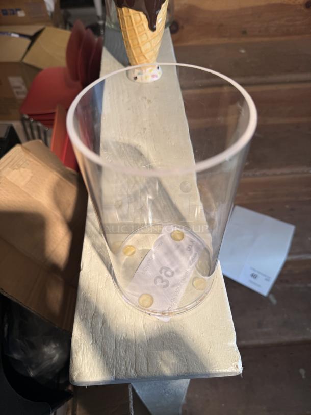 Large clear glass cylinder vase, versatile for décor, in excellent condition. Includes "3a" sticker and protective pads on base.