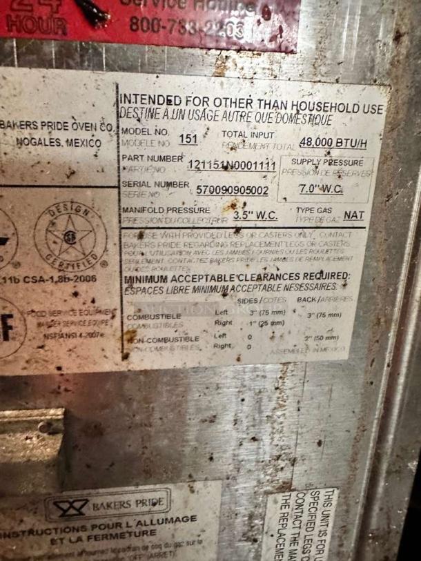 Label on Bakers Pride 151 Super Deck pizza oven showing model, serial number 570090905002, and gas specs.