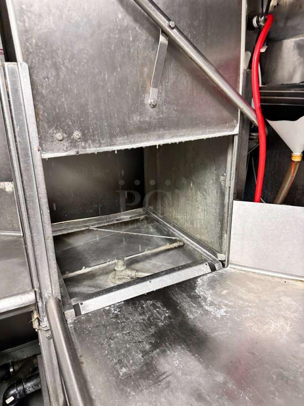 Ecolab/Hobart ES-2000 commercial conveyor dishmachine in excellent condition, showing stainless steel interior and components.