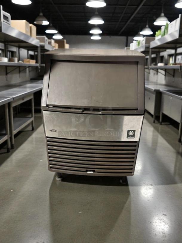 Manitowoc Q210 commercial undercounter ice machine in pristine condition; fully tested, dice cube ice, front view.