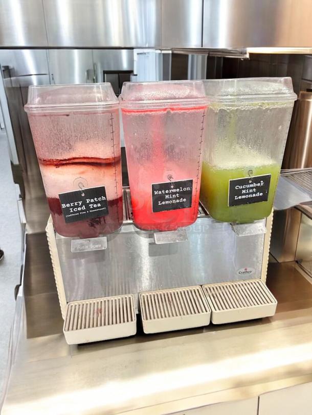 Crathco D35-4 Commercial Beverage Dispenser, 4-flavor, excellent condition, fully tested, 115V, labels show beverage types.