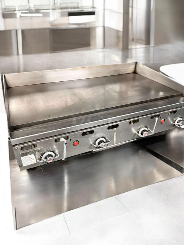 Vulcan commercial gas flat top griddle, stainless steel, excellent condition, fully tested, three control knobs, natural gas.