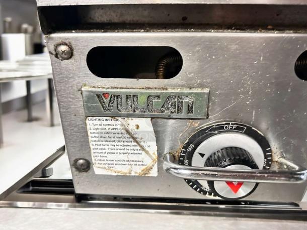 Vulcan heavy-duty commercial gas griddle, outstanding condition, control knob visible. Brand label and lighting instructions included.