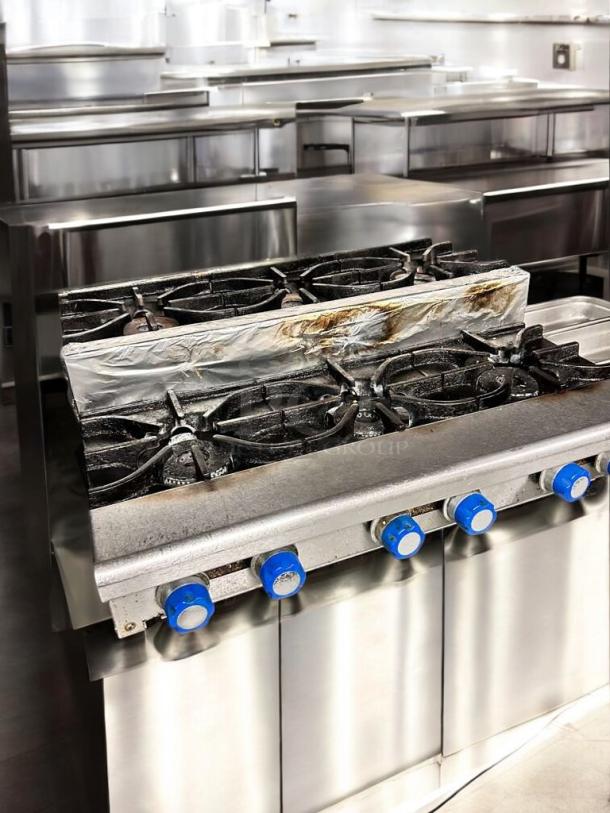 Imperial IHPA-8-48SU 48" commercial gas hotplate, 8 burners, step-up design, natural gas, excellent condition, blue knobs.