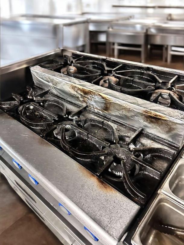 Imperial IHPA-8-48SU 48" commercial gas hotplate with 8 burners, featuring a step-up design. In exceptional condition.