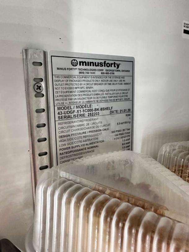 Label on Minus Forty Dual Glass Door Commercial Display Refrigerator, model 43-UDGF-X1-1C000-BK-8SHELF, indicating technical details and specifications.