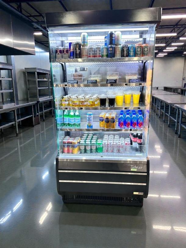 Turbo Air TOM-40B-N commercial open-front refrigerator in superb condition, 115V, fully tested and working, stocked with beverages.