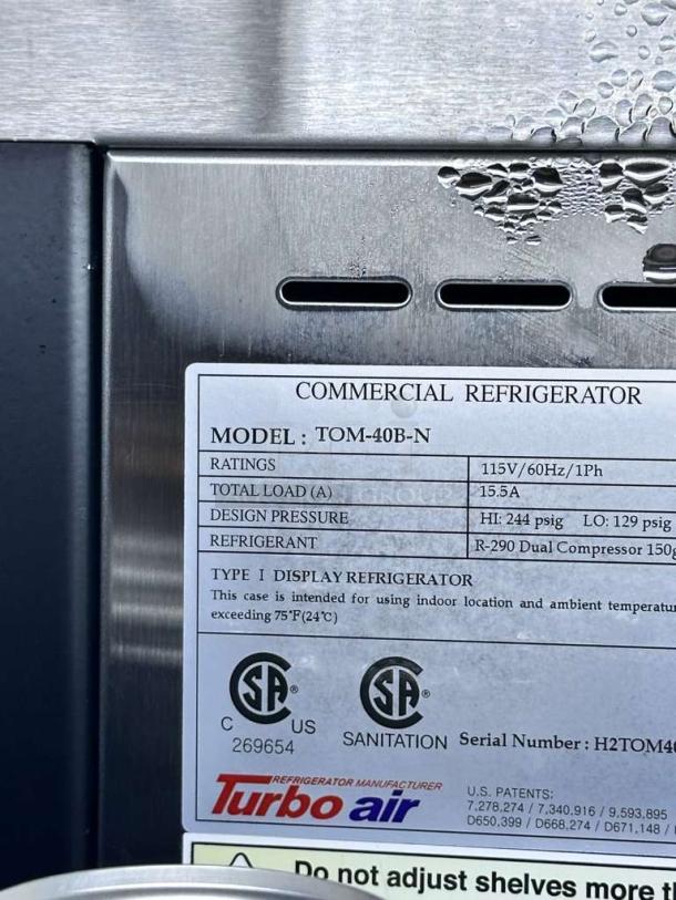 Turbo Air TOM-40B-N display refrigerator label showing model details, 115V rating, R-290 refrigerant, and CSA certification.