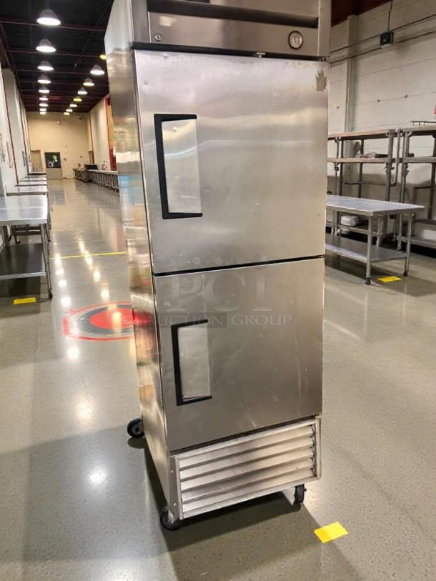 Pristine True T-23-2 commercial reach-in refrigerator, stainless steel, dual doors, 115V, excellent condition, fully tested.