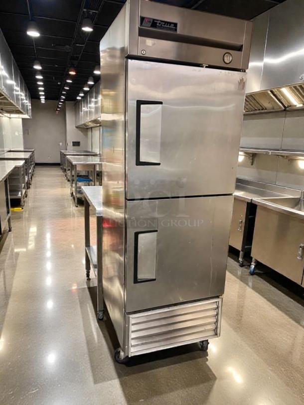 Pristine True T-23-2 commercial reach-in refrigerator, dual doors, stainless steel, 115V, fully tested, excellent condition.