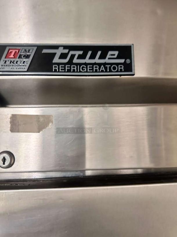 True T-23-2 commercial refrigerator, pristine condition, stainless steel, logo label visible, 115V, True Manufacturing Co.
