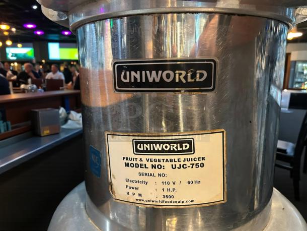 Uniworld UJC-750E electric juice extractor, 17-inch, stainless steel, automatic pulp extractor, label shows 110V, 1HP.
