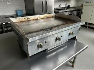 American Range ARSMG-36 countertop gas griddle in great condition, tested and working, with control knobs and metal finish.