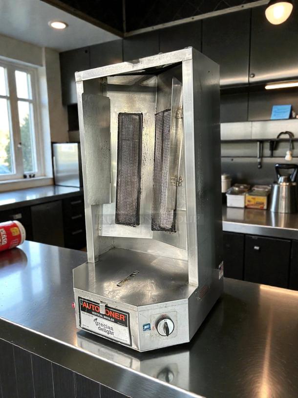 Autodoner 3PG Autodoner gas vertical broiler in superb condition, 65 lb capacity, tested and working, stainless steel exterior.
