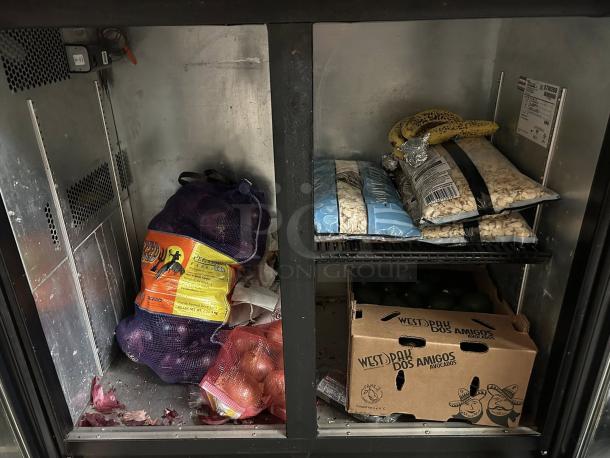 True Model TBB-24-48G LD bar refrigerator with two glass doors. Black, tested, working. Shows interior storage space with food.