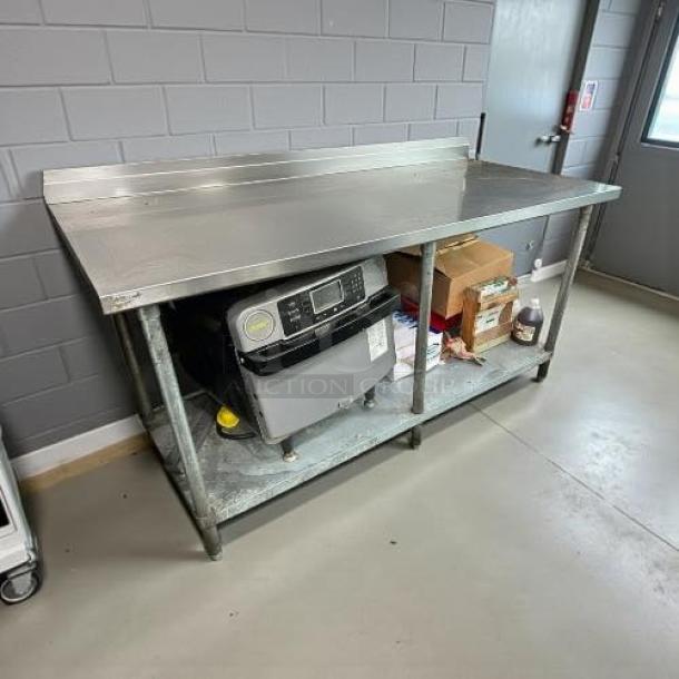 GSW WT-E3072 stainless steel work table, 30x72 inches, with galvanized undershelf. Sturdy, good condition.