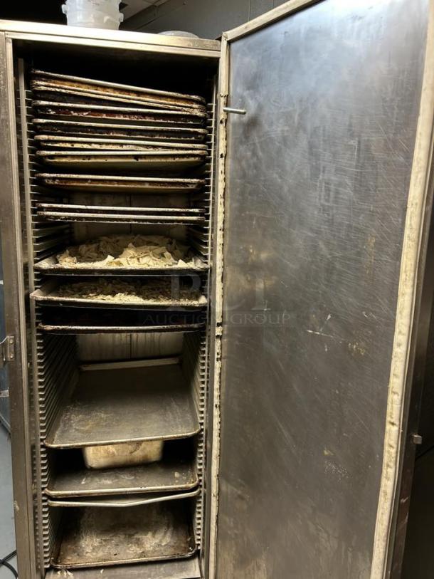 Carter-Hoffmann PH1800 mobile heated transport cabinet with multiple shelves, open door, in tested and working condition.