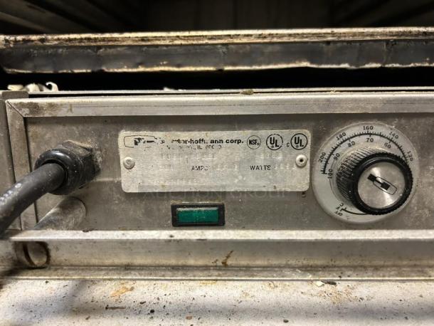 Carter-Hoffmann PH1800 heated transport cabinet control panel, showing temperature dial, power label, and indicator light.