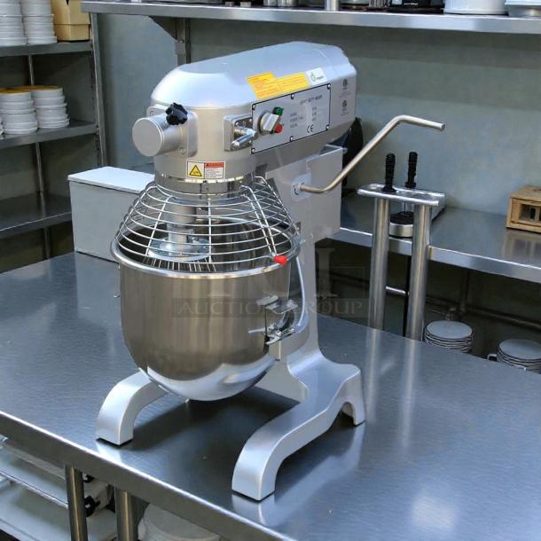 Uniworld UPM-20LET 20 Quart Mixer, electric, perfect condition, stainless steel bowl, tested and working, on kitchen counter.