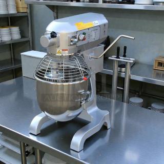 Uniworld UPM-20LET 20 Quart Mixer, electric, perfect condition, stainless steel bowl, tested and working, on kitchen counter.