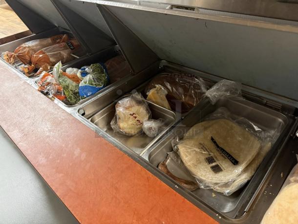 Delfield 4472NP-30M 72" Mega Top Sandwich Prep Cooler in amazing condition, featuring multiple compartments for fresh ingredients.