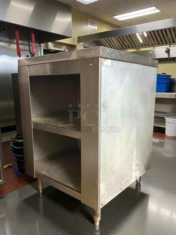 All stainless steel worktop table, 24", shelves, great condition, sturdy. Brand: American. Ideal for commercial kitchens.