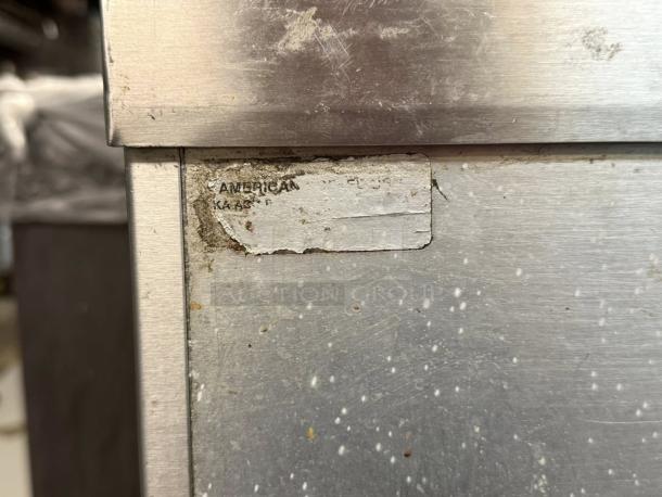 All stainless steel 24” worktop table, American brand, great condition. Features cabinets with shelves, sturdy and durable. Appears used with minor wear.