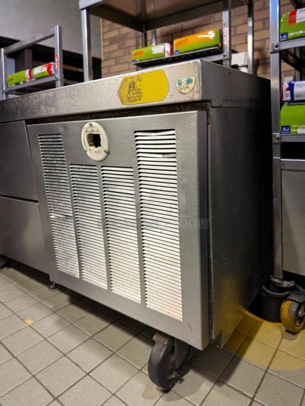 Delfield F2996CP 96" 6 Drawer Low Profile Refrigerated Chef Base, tested, working, metal, on wheels, minor wear.