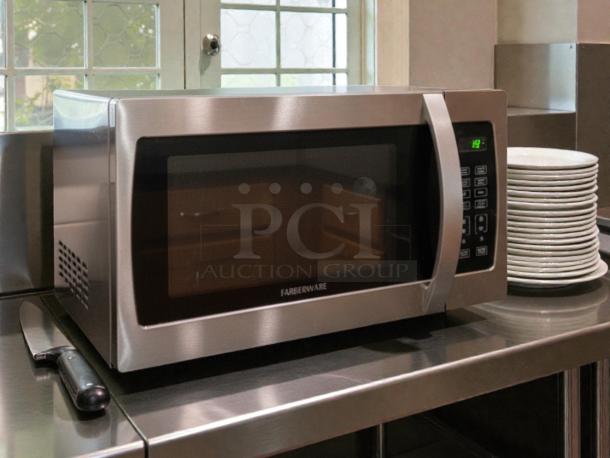 Farberware Professional 1.3 cu ft 1000-Watt Microwave Oven in perfect condition. Stainless steel exterior, digital controls.