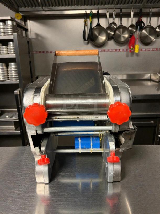 Junchu RSS-180C pasta maker, stainless steel, excellent condition. Features electric dough roller, wood handle, red dials. Tested and working.