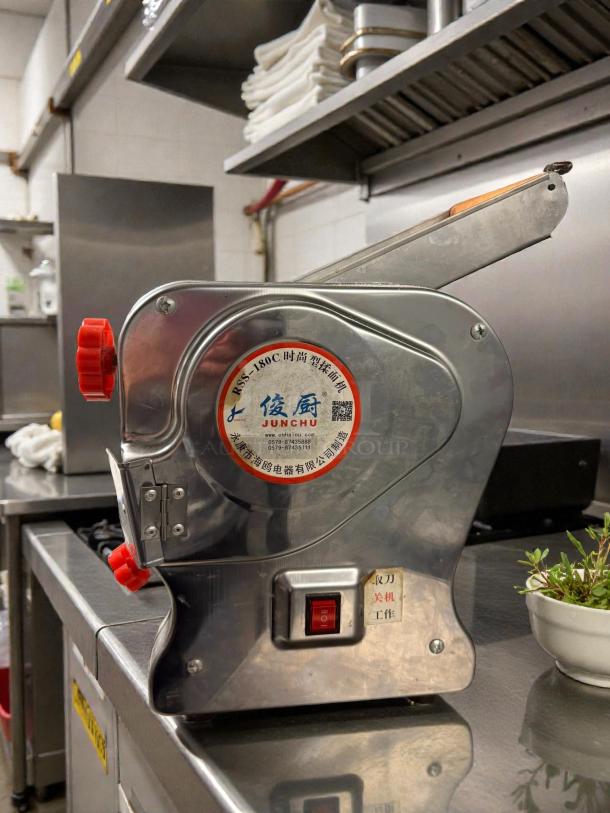 Junchu RSS-180C automatic stainless steel pasta maker in excellent condition, showing labels and red controls, tested and working.