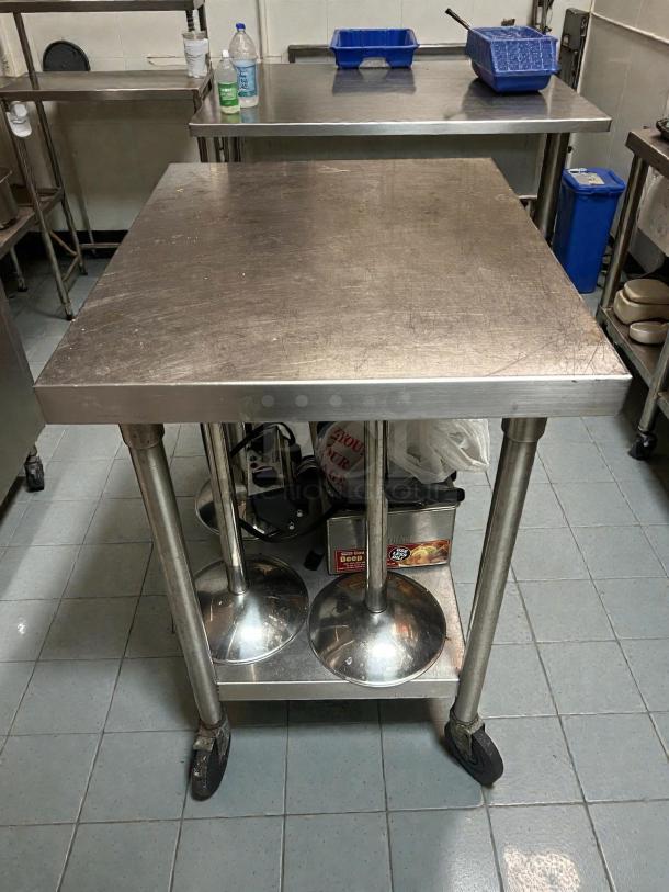 Omniteam 24x24 in. stainless steel work table with casters, excellent condition, swivel feature, sturdy legs.