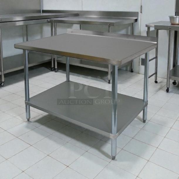 Stainless steel GSW 48" x 30" work table with 1-1/2" rear upturn and lower shelf; sturdy and ideal for kitchen use.