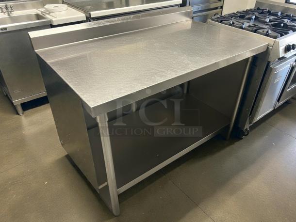 GSW 48" x 30" work table with stainless steel top, 1-1/2" rear upturn, and sturdy construction. Excellent condition.