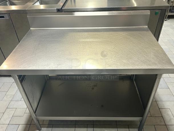 GSW 48" x 30" stainless steel work table with 1-1/2" rear upturn, sturdy construction, clean condition.