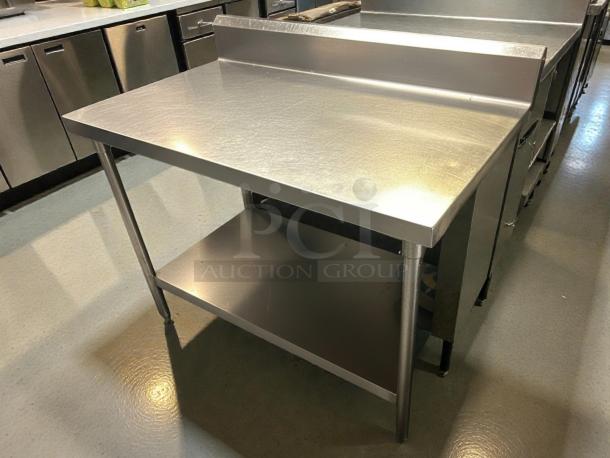 GSW 48" x 30" work table with stainless steel top and 1-1/2" rear upturn. Features a sturdy lower shelf, excellent condition.