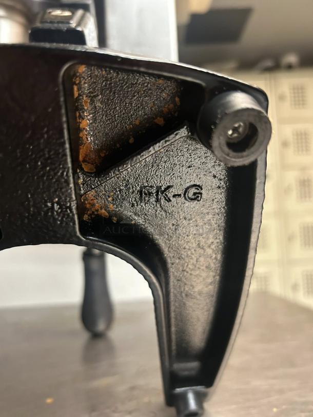 Zulay Kitchen Cast-Iron Orange Juice Squeezer, heavy-duty, working condition, visible rust, model marking "FK-G".