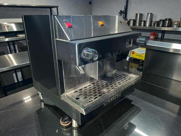 Astra Mega I M1-011-1 automatic espresso machine, 110V, tested working, excellent condition, stainless steel, two knobs, drip tray.