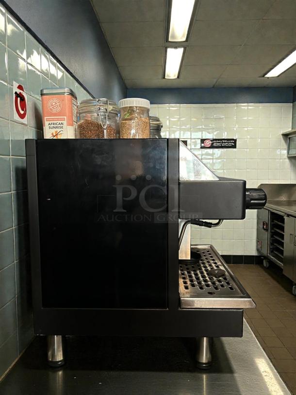 Astra Mega I M1-011-1 automatic espresso machine in amazing condition, 110V, tested and working, shown in a kitchen setting.