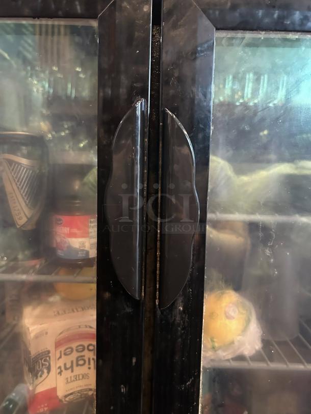 Dukers DBB60-H2 glass door bar cooler in perfect condition, features double-section and spacious interior storage.