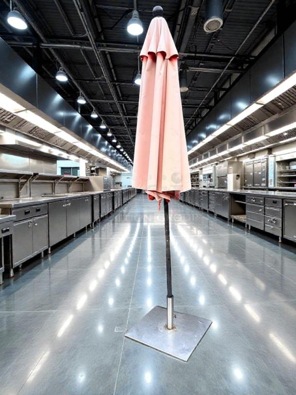 Commercial outdoor patio umbrella, heavy-duty, refined condition, standing in a sleek indoor setting. Fully inspected and ready to use.