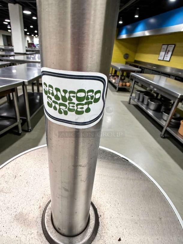 Three commercial-grade stainless steel patio heaters in superior condition with mushroom tops, "Sanford Street" label, tested and ready.